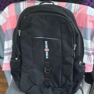 Swiss Gear backpack. Fits laptop and has 2 side pockets. Also one front pocket